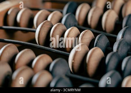 Vintage wooden abacus lying on the table , close up Stock Photo