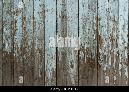 Peeling paint on old and rustic wooden wall. Image with Instagramm vintage effect, blurry due to selective focusing and for background purposes only. Stock Photo