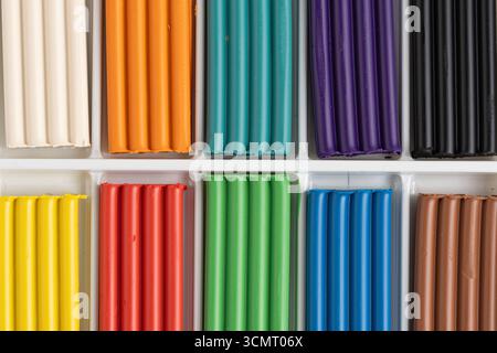 Multi colored plasticine for children in box closeup Stock Photo