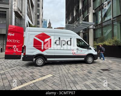 Side view of a DPD delivery van while out on a parcel delivery round in central London with his rear door open. Stock Photo