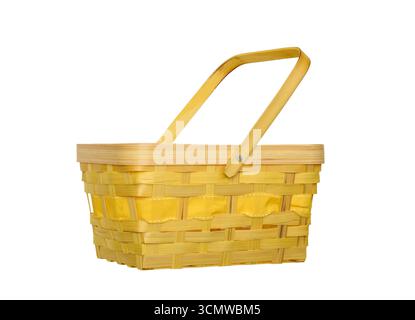 Empty bright yellow basket made from wood splints, isolated on white background, side view. Rustic woven container for storage, decoration, crafts, or Stock Photo