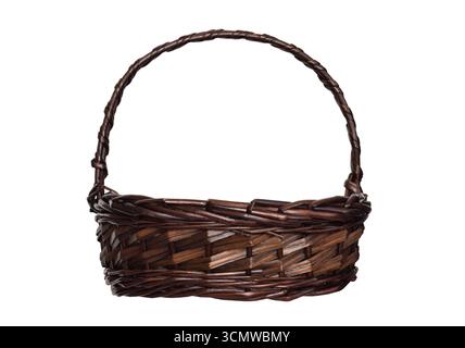 Empty dark brown wicker basket isolated on white background. Rustic woven container for storage, decoration, or craft use Stock Photo