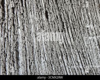 Decorative plaster. Wood texture on plaster. Close-up. Stock Photo