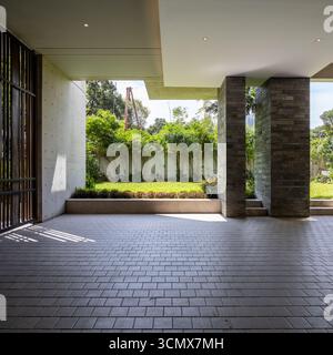 Spacious and bright entryway with modern design elements, seamlessly blending indoor and outdoor living. Stock Photo