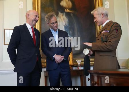 An army representative (right) speaks to Defence Secretary John Healey (left) and the CEO of software company Palantir Technologies Alex Karp at the signing of a £1.5 billion investment, unveiled as part of US President Donald Trump's historic second state visit, at Wellington Conference Room, Horse Guards, Whitehall, London. Picture date: Thursday September 18, 2025. Stock Photo