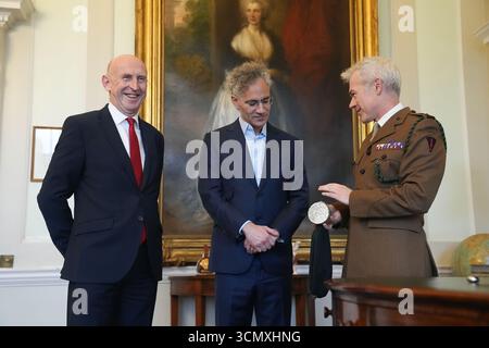 An army representative (right) speaks to Defence Secretary John Healey (left) and the CEO of software company Palantir Technologies Alex Karp at the signing of a £1.5 billion investment, unveiled as part of US President Donald Trump's historic second state visit, at Wellington Conference Room, Horse Guards, Whitehall, London. Picture date: Thursday September 18, 2025. Stock Photo