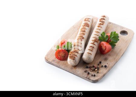 Grilled Bratwurst sausages with cherry tomatoes and parsley isolated on white background Stock Photo