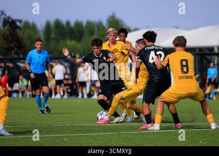 Torino, Italy: September 16, 2025 - Antonio Merola of Juventus FC challenged during the UEFA Youth League match against Borussia Dortmund. Stock Photo