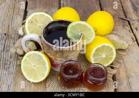 Ginger tea with lemon an honey on a wooden table Stock Photo