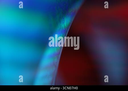Blue liquid surface, oil stains movement, bright chemistry, surreal background, arctic blue rainbow, water surface, ink and water Stock Photo