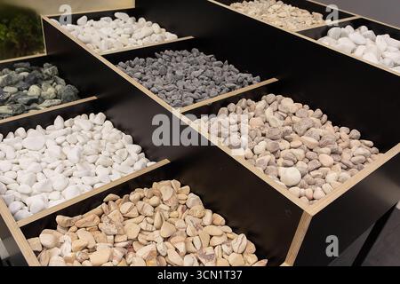 Samples of natural decorative stone in a showroom. Industry Stock Photo