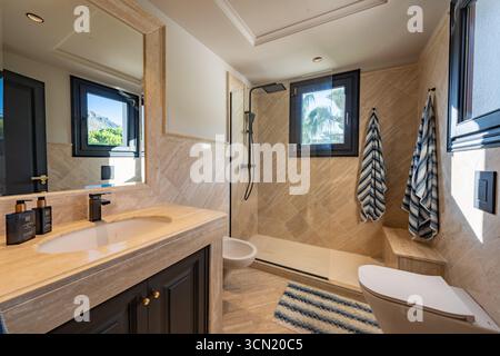 an image of a luxury marble bathroom in mediterranean holiday home Stock Photo