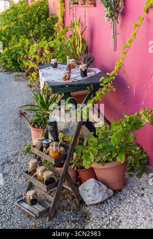 aa selection of traditional Greek local products on sale at a small local farmers market shop on the Ionian Island of Zante or Zakynthos in Greece Stock Photo