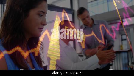 Reviewing female in sleeveless blouse analyzing stock chart in office, with smartphone copy space. Corporate, collaboration, analytics, digital, works Stock Photo