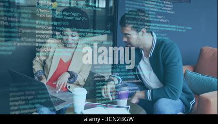 Reviewing code two engineers in blazers collaborating on laptop in office lounge with coffee cups. Collaboration, innovation, teamwork, modernity, tec Stock Photo