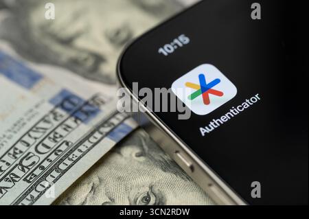 New York, USA - September 12, 2025: Google Authenticator app on smartphone screen with dollar background close up view Stock Photo