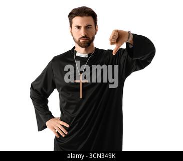 Upset priest showing thumb-down on white background Stock Photo