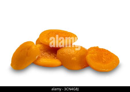 Canned peach halves in syruo isolated on white background with clipping path. Stock Photo