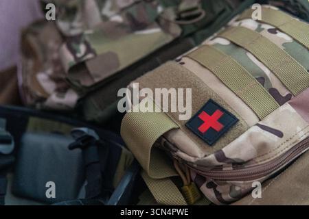 Military First Aid Kit with Red Cross Patch Stock Photo