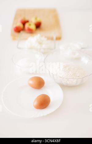 Preparing ingredients for baking apple pie on white table Stock Photo
