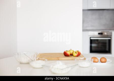 Ingredients for apple pie waiting on kitchen table Stock Photo