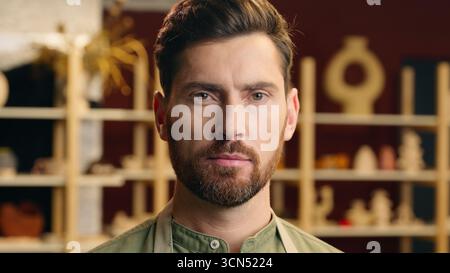 Professional serious calm Caucasian man businessman guy male portrait small business owner seller entrepreneur potter headshot artist salesman Stock Photo