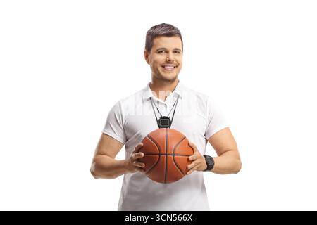 Basketball coach holding a ball and smiling at camera isolated on white background Stock Photo