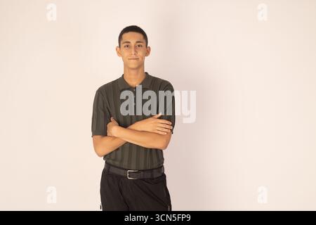 Young man is standing with his arms crossed Stock Photo
