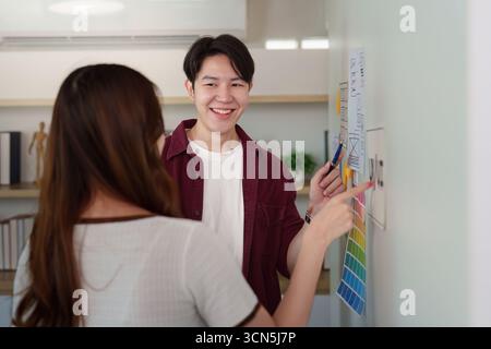 Creative Team Discussing UX UI Design Concepts Stock Photo