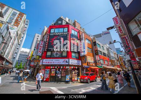 Modern commercial building on Nibangai Street at Chuo dori Street in West Shinjuku, Shinjuku City, Tokyo, Japan. Stock Photo