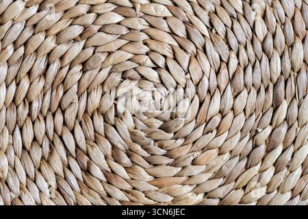 Close-up pattern of round woven placemat made from natural water hyacinth Stock Photo