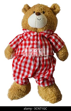 soft Teddy bear wearing red and white gingham outfit isolated on white background Stock Photo