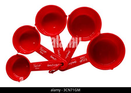 Set of red Betty Crocker measuring cups isolated on white background - Nesting Measuring Cups With Pour Spouts Stock Photo