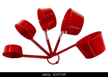 Set of red Betty Crocker measuring cups isolated on white background - Nesting Measuring Cups With Pour Spouts Stock Photo