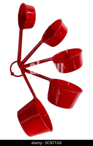 Set of red Betty Crocker measuring cups isolated on white background - Nesting Measuring Cups With Pour Spouts Stock Photo