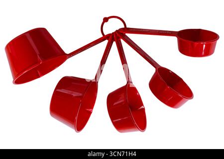 Set of red Betty Crocker measuring cups isolated on white background - Nesting Measuring Cups With Pour Spouts Stock Photo