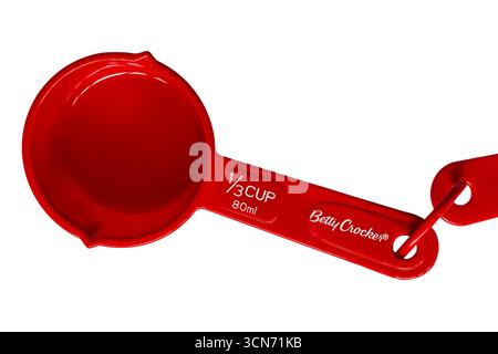 red Betty Crocker measuring cup size 1/3 cup 80ml set on white background Stock Photo