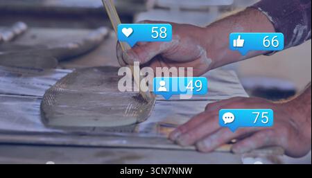 Spreading male hands applying gray mortar on work bench with notched trowel and notification icons Stock Photo