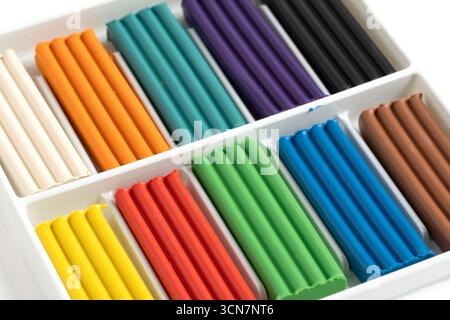 Colorful plasticine in box on white background close up Stock Photo