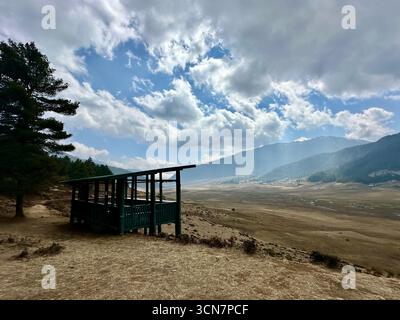 wooden shelter overlooking the vast Phobjika Valley in Bhutan Stock Photo