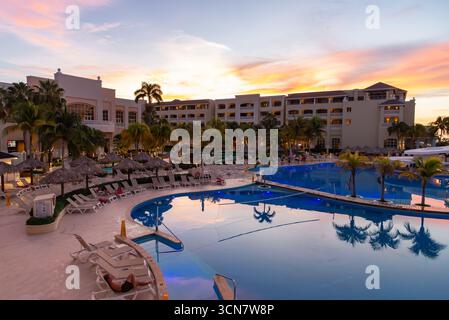 Beautiful sunset overlooking resort pool in Montego Bay, Jamaica. Stock Photo