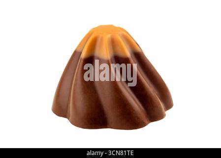 A chocolate dessert shaped like a volcano. The chocolate is brown and has a swirl pattern. The dessert is sitting on a white background Stock Photo