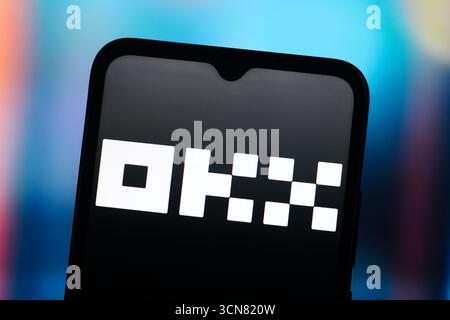 In this photo illustration, the OKX logo is seen displayed on a smartphone screen. Stock Photo