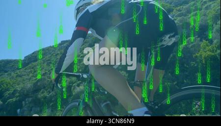 Pedaling cyclist in helmet, jersey on road bike up mountain road, with binary overlay, copy space Stock Photo