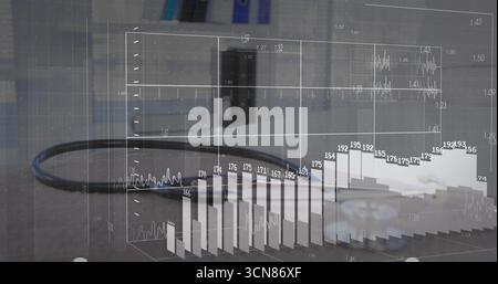 Displaying black cable with 3D data overlay on grey office desk, featuring gear piece and monitor Stock Photo