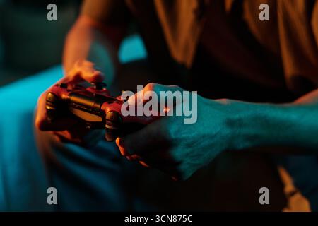 Man Playing Video Game with Wireless Controller Indoors Stock Photo