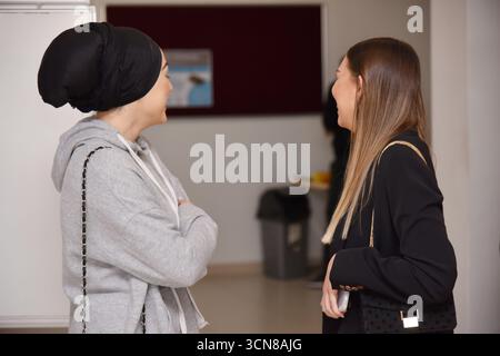 Two University Students Studying Math in Front of a Whiteboard, Preparing for Their Exam at Home Stock Photo