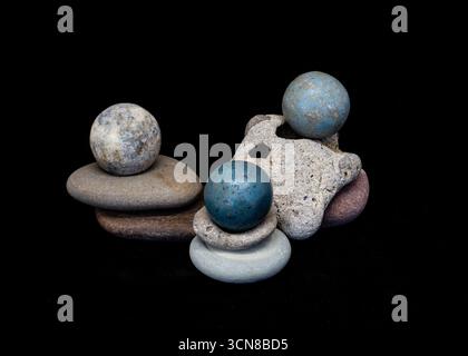 Balanced rocks and marbles composition Stock Photo