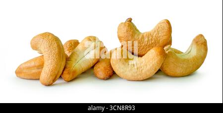 Roasted peeled cashew nuts in stack are isolated on white background with clipping path. Stock Photo