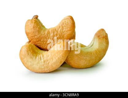 Roasted peeled cashew nuts in stack are isolated on white background with clipping path. Stock Photo